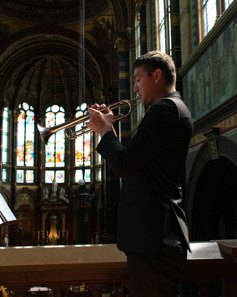 June 10: Jacob Lange performs a trumpet solo from the balcony of St. Nicholas Basilica (pc: Sam Held)