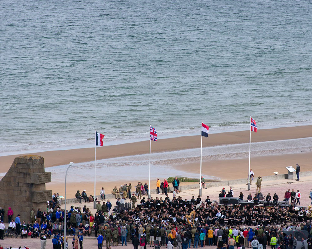 D-Day Memorial Wind Band performs on Omaha Beach (pc: Sam Held)