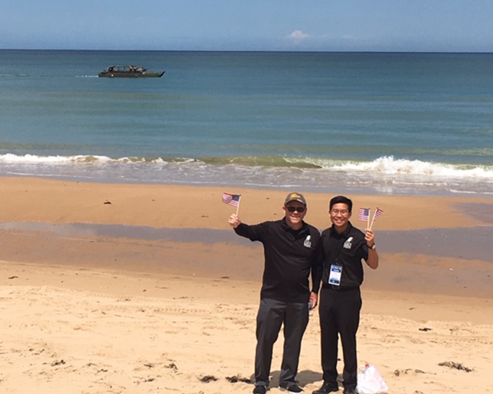 Dr. Held and Khoi Vu on Omaha Beach (photo credit: Nadine Leplat)