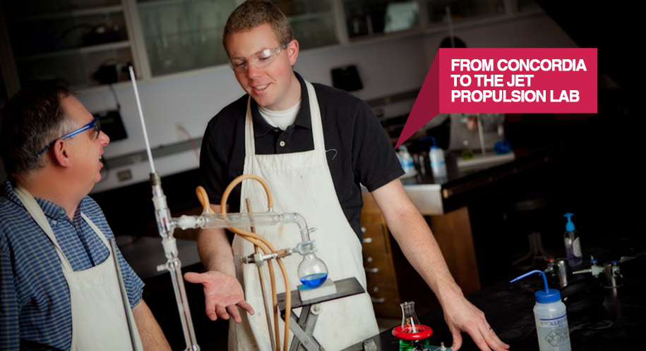 Dr. Evan Neidholdt and Dr. John Kenney working in the lab together