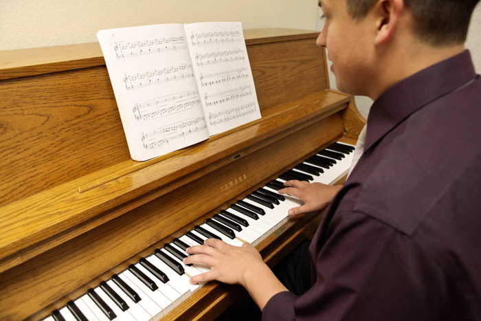 A student practices piano