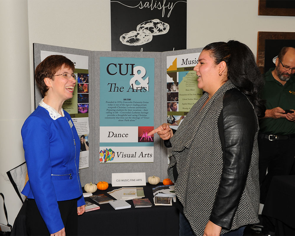 Two girls talking about a presentation