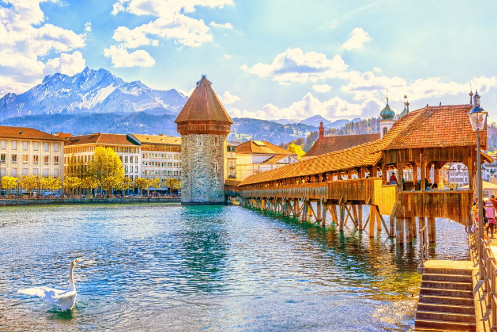 Beautiful bridge over water with mountains in the background
