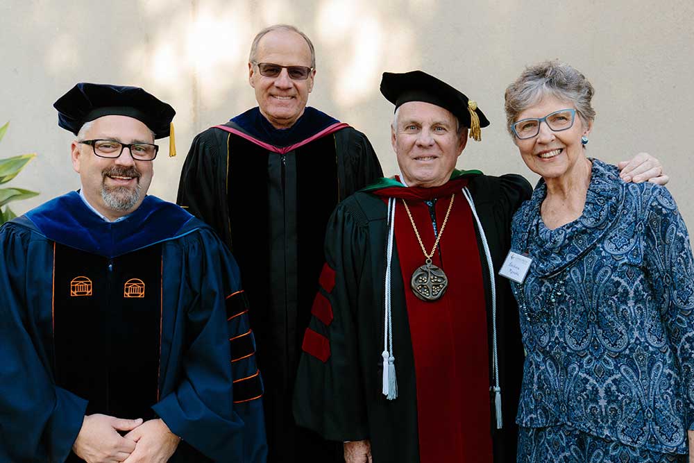 President Thomas posing with other guests