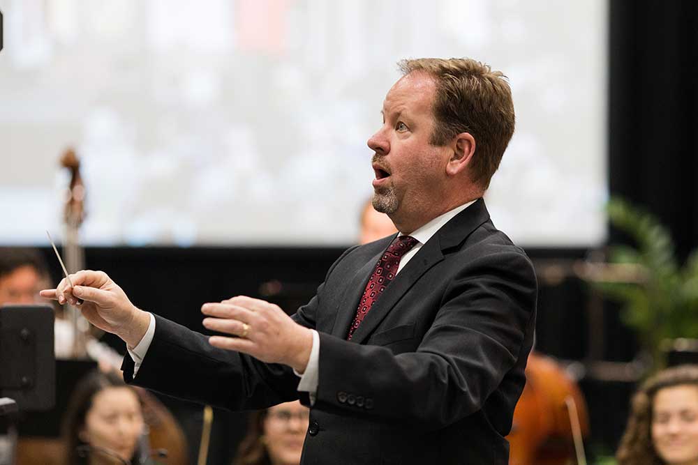 Conductor directing the orchestra