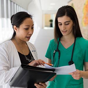 Two healthcare professionals having a conversation