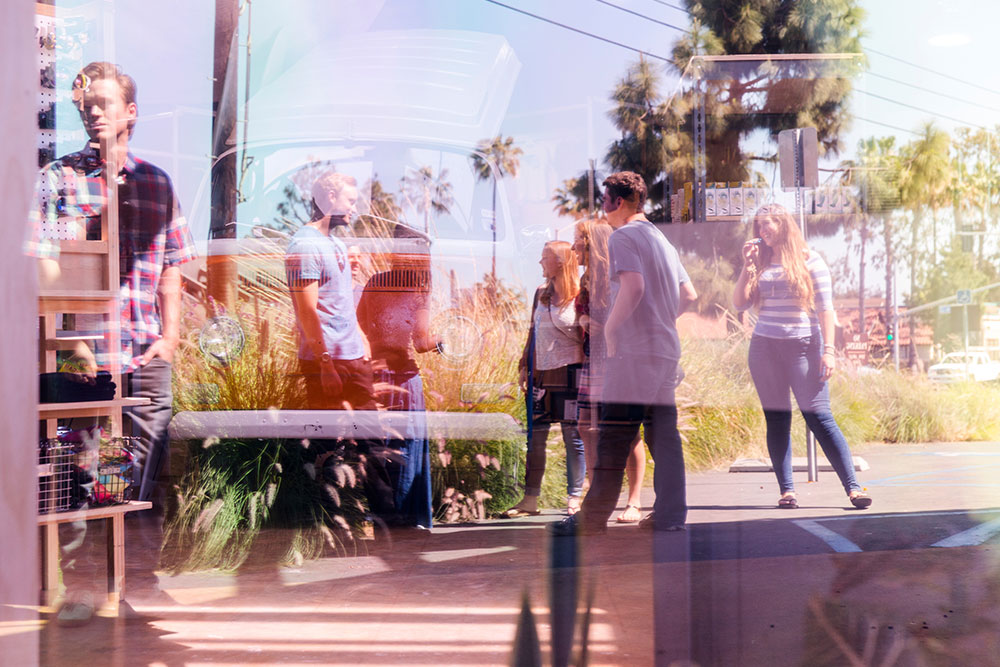 Students through a store window