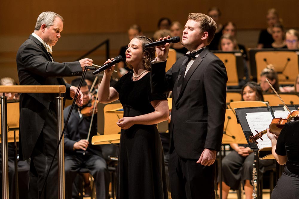 Dr. Held conducting orchestra and soloist