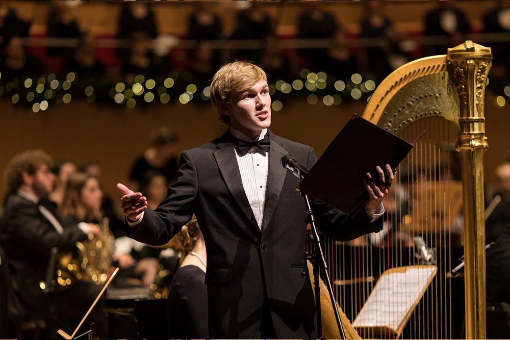 Male student reading for concert