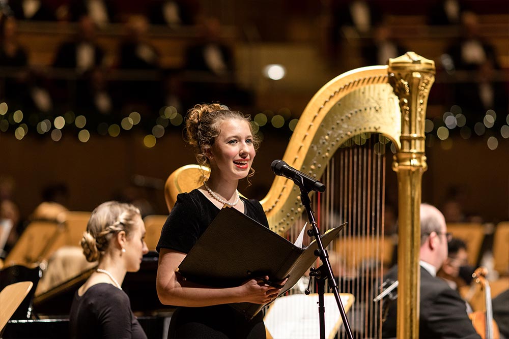 Female student reading for Christmas concert