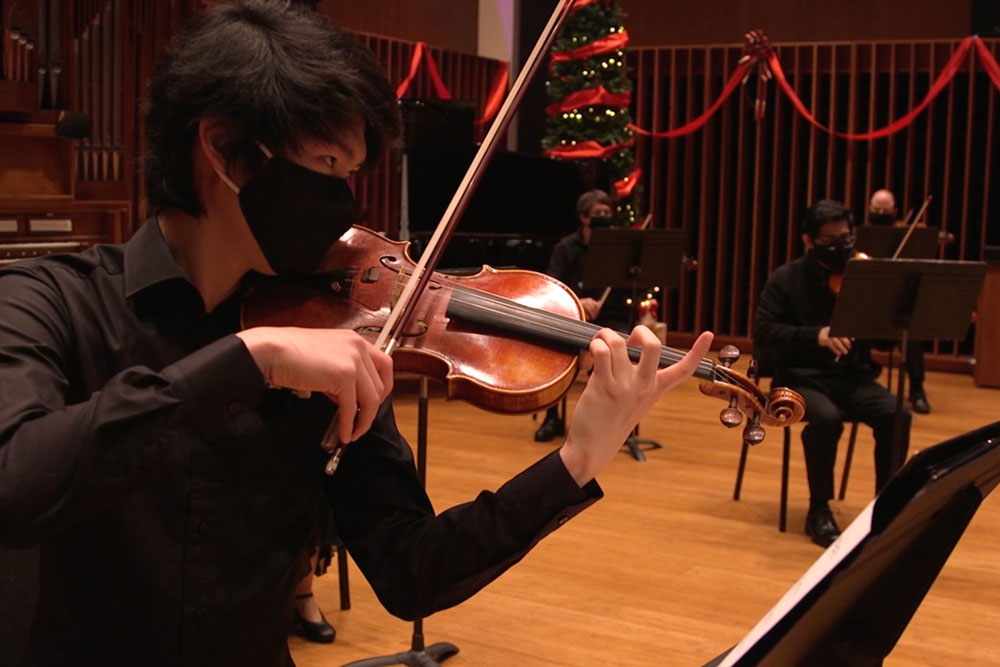 Students performing in orchestral hall