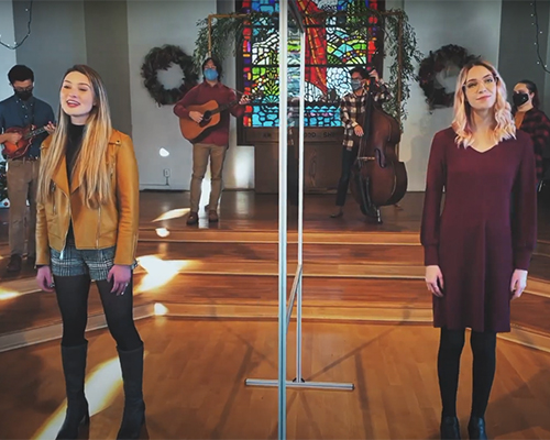 students singing in the good shepherd chapel