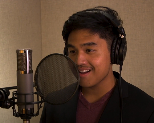 a student singing into a microphone