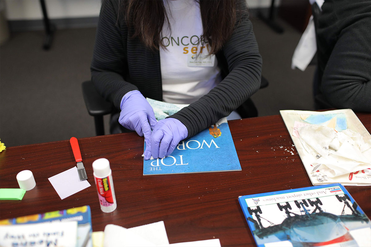 Student repairing a book