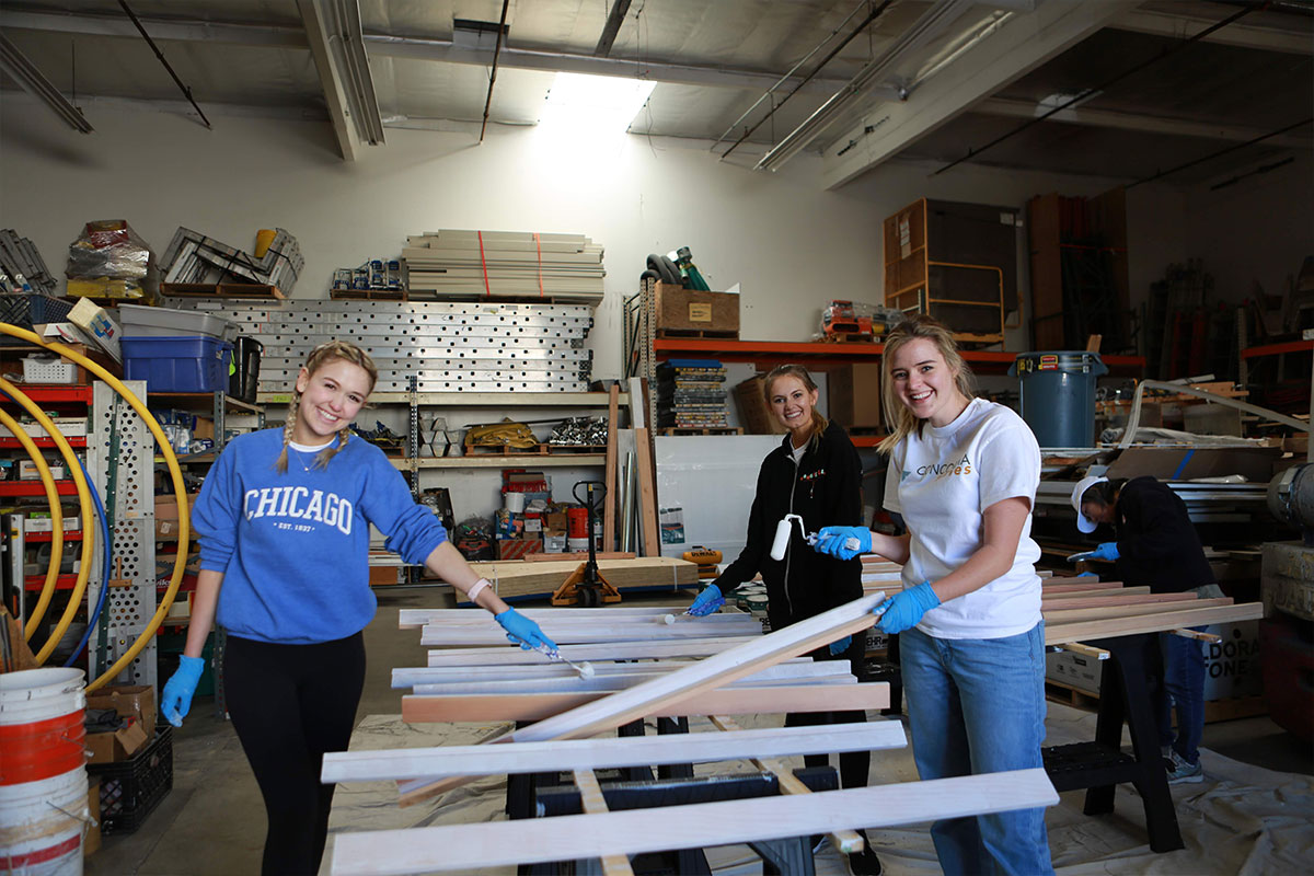 Three students volunteering