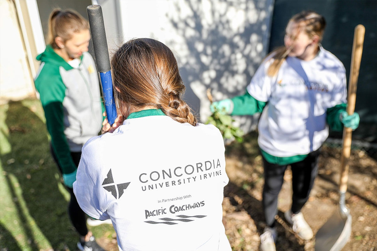 Three students gardening. Photo credit: Alexander Kitano