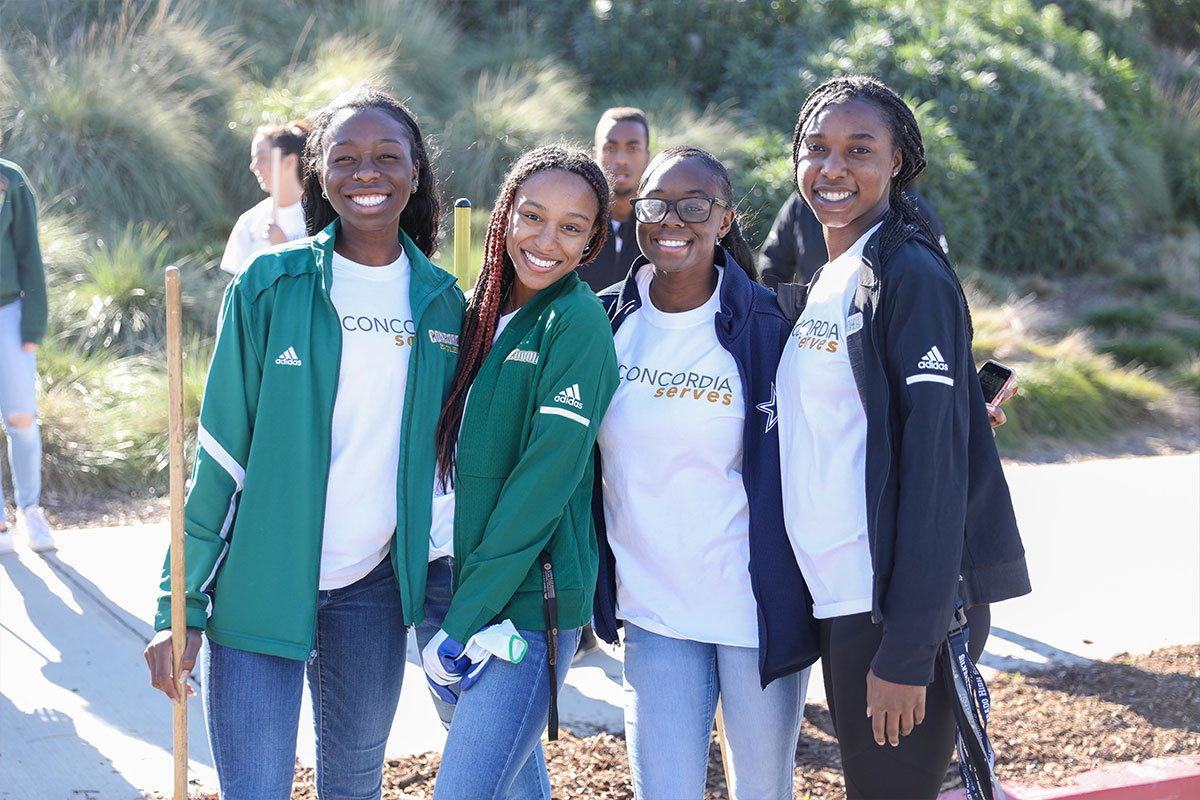 Four students volunteering. Photo credit: Alexander Kitano