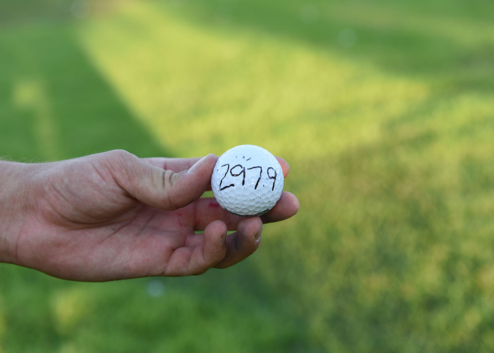 A hand holding the game winning golf ball