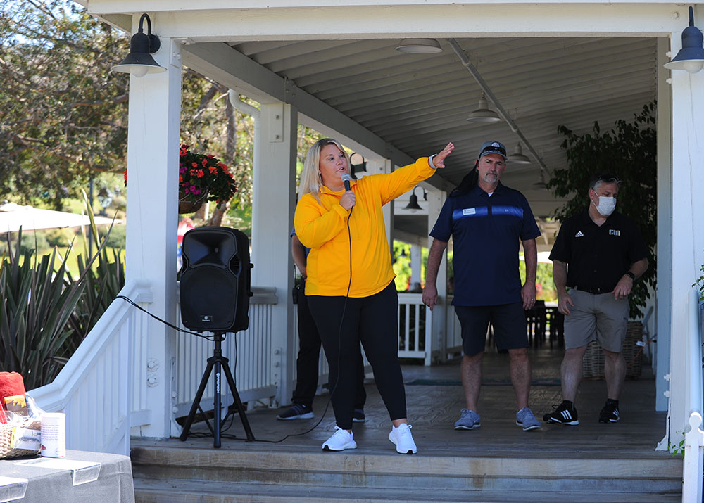 A woman speaking into a microphone