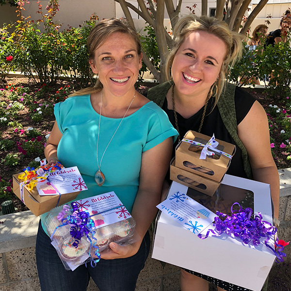 Women holding homemade goodies