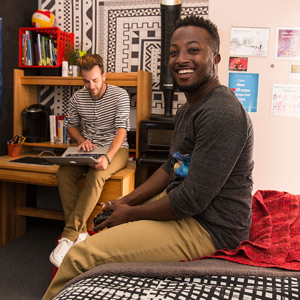 Two male students in their dorm room