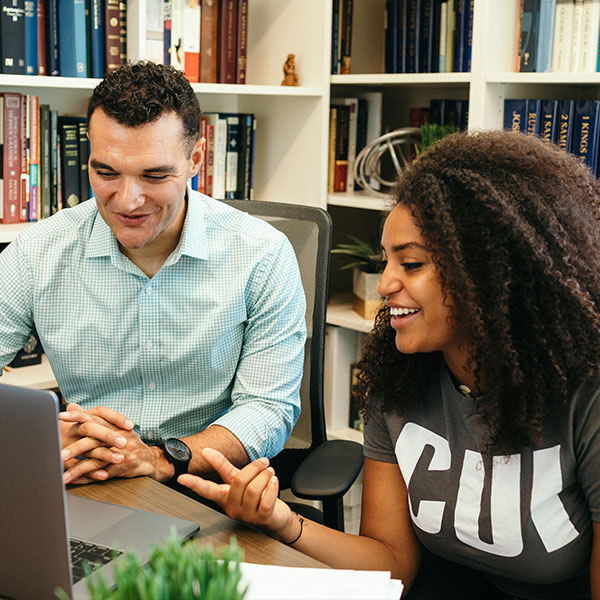 Female student speaking with a professor