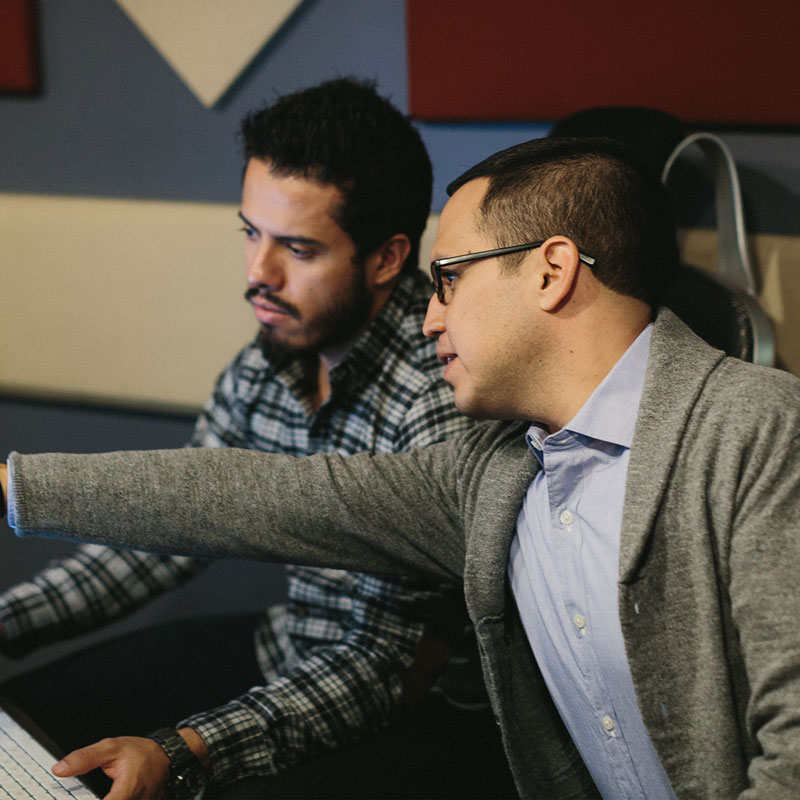 Two males working together