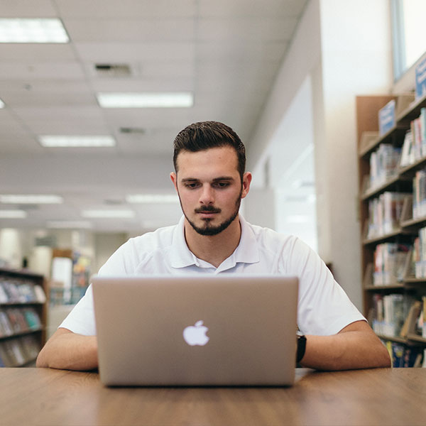 Male student on a computer