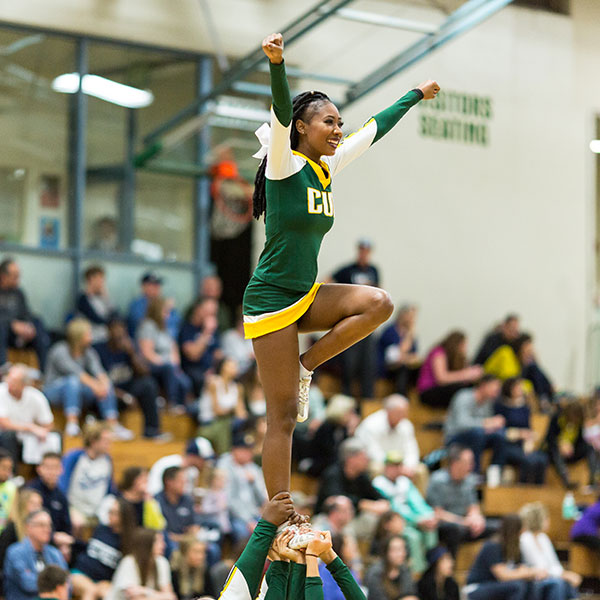 CUI cheer team performing at a game