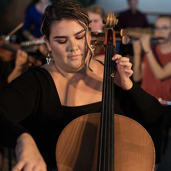 Female student playing the cello