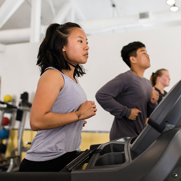 Female student exercising in the CU Active gym