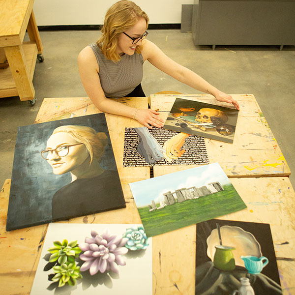 Female student presenting her artwork