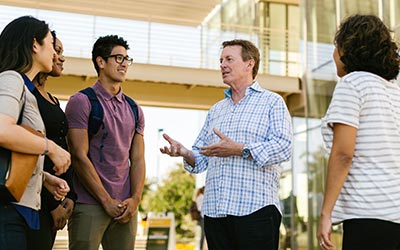 Dr. Townsend and students in front of Grimm Hall