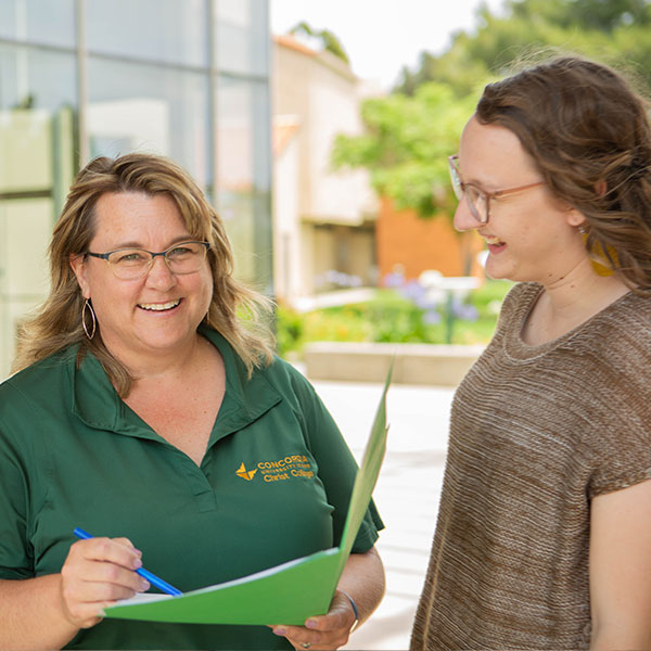 Student and faculty talking