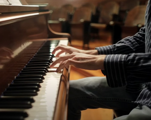 Composer playing the piano