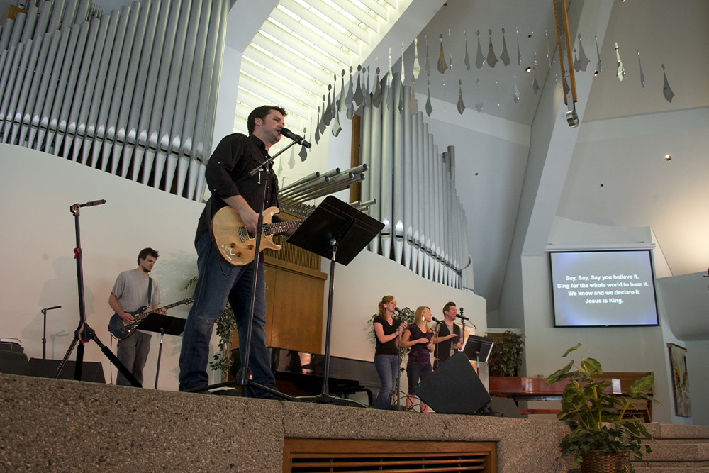 A band leads worship in the CU Center.
