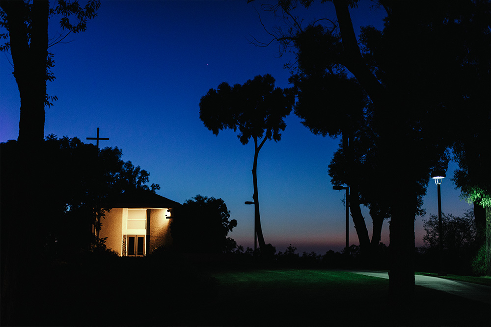 The Good Shepherd Chapel hilltop at night is a great vantage point to catch Disneyland’s fireworks.