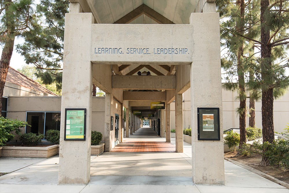 The Gym Breezeway is etched with the core values of Learning. Service. Leadership.