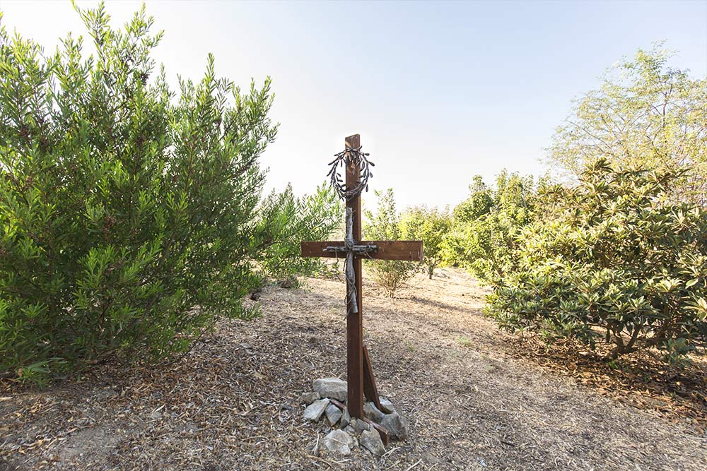 A wooden cross in the Heritage Garden