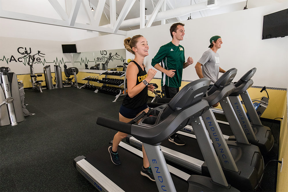 Students jog on treadmills in the CU Active Fitness Center.