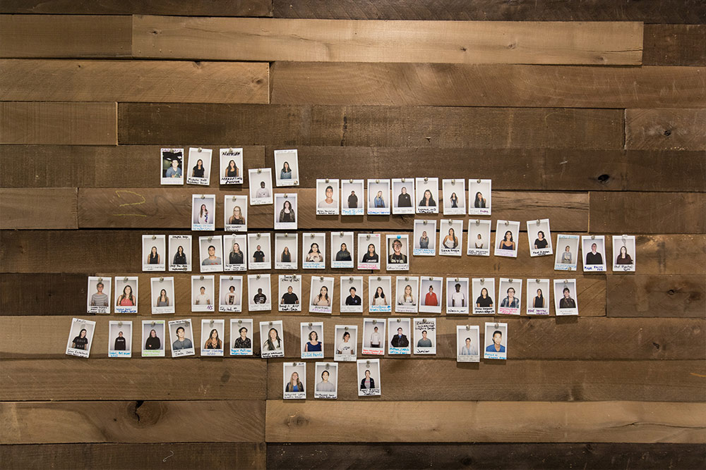 Polaroid portraits of students in the Art Studio hallway