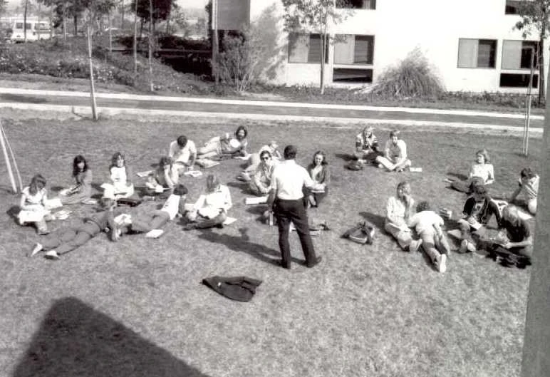 First class gathered outside the campus, 1976