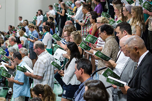 The crowd participating in worship