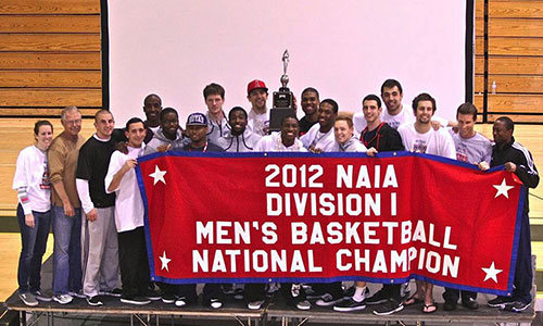 CUI men's basketball team celebrating