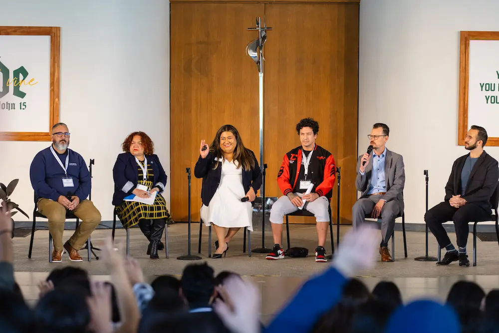 Panel of speakers on stage