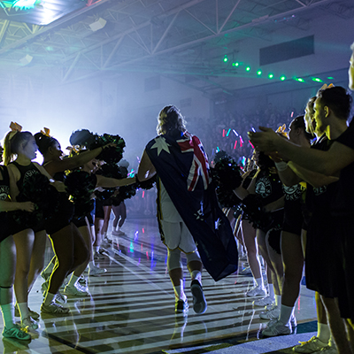 Australian athlete walking onto the indoor court