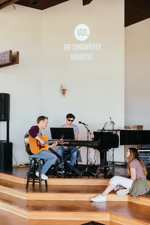 3 members of the songwriter retreat worshipping