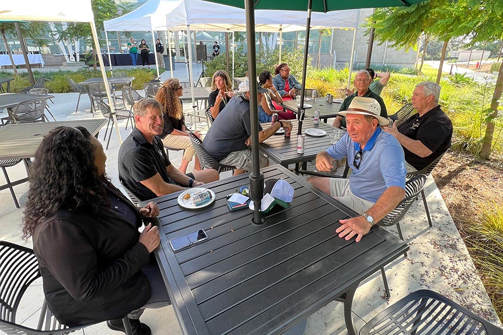 Alumni socializing in front of the BMC