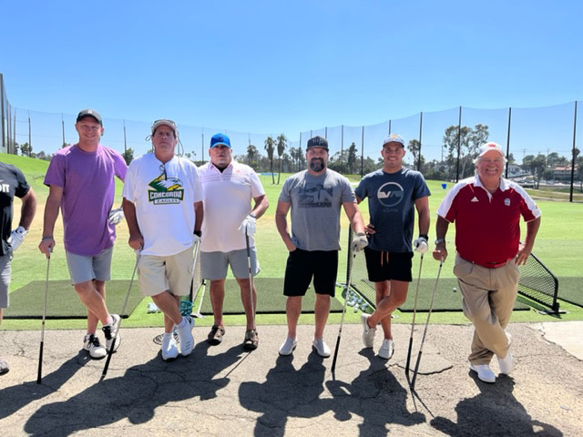 Men line uped to play golf