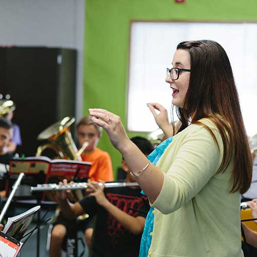 Music Teacher with students